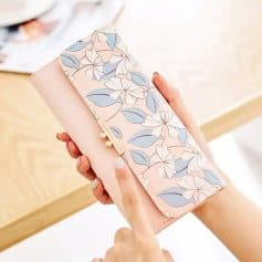 Elegant floral wallet with pink and blue tones, perfect for women seeking stylish and functional accessories. Ideal for organizing cards, cash, and essentials while showcasing a delicate design.