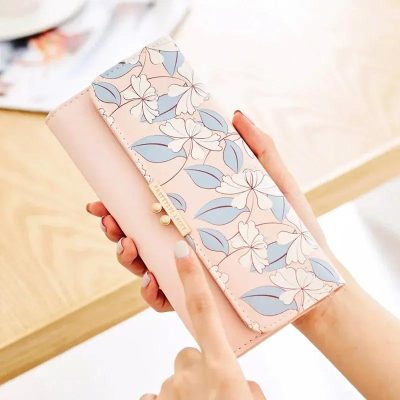 Elegant floral wallet with pink and blue tones, perfect for women seeking stylish and functional accessories. Ideal for organizing cards, cash, and essentials while showcasing a delicate design.