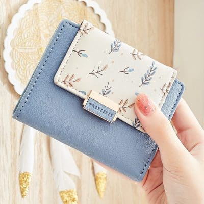 Blue leather wallet with floral card holder, stylish and functional, ideal for women’s accessories and everyday use.