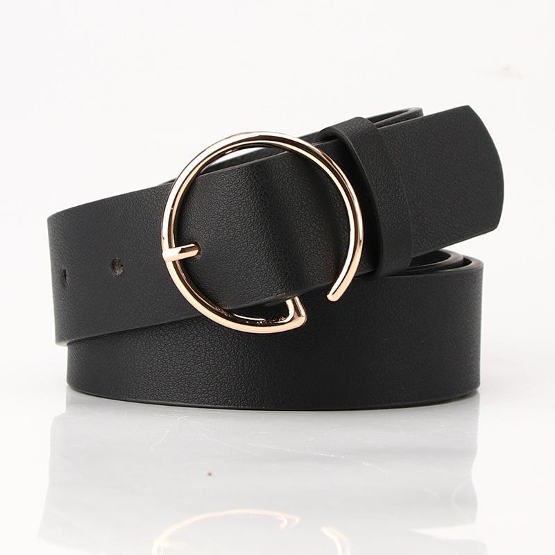 Black leather belt with a rose gold circular buckle, stylish accessory for fashion-conscious individuals. Perfect for dressy or casual outfits, adding elegance to your look.
