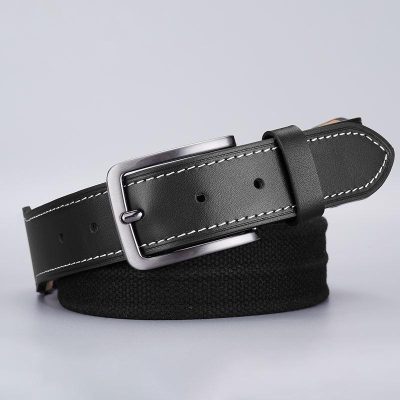 Black leather belt with white stitching and silver buckle, suitable for men's fashion accessories.