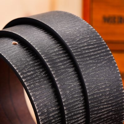 Black leather belt with textured finish, close-up shot, Monalisa Store opt, stylish accessory for formal and casual wear, high-quality craftsmanship, durable and timeless fashion piece.