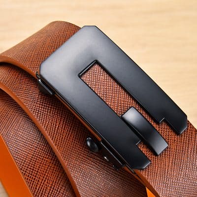 Black headset with adjustable headband resting on a textured brown leather surface. Modern, stylish design perfect for professional or casual use, emphasizing comfort and durability.