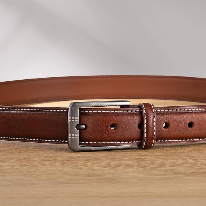 Genuine leather brown men's belt with silver buckle, crafted for stylish formal and casual wear. Perfect accessory for enhancing any wardrobe with classic elegance.