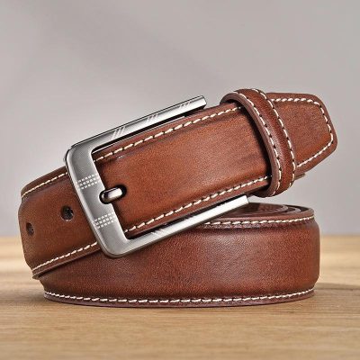 Luxurious brown leather men’s belt with silver buckle, stylish accessory for formal and casual wear. Durable genuine leather and classic design for versatile fashion.