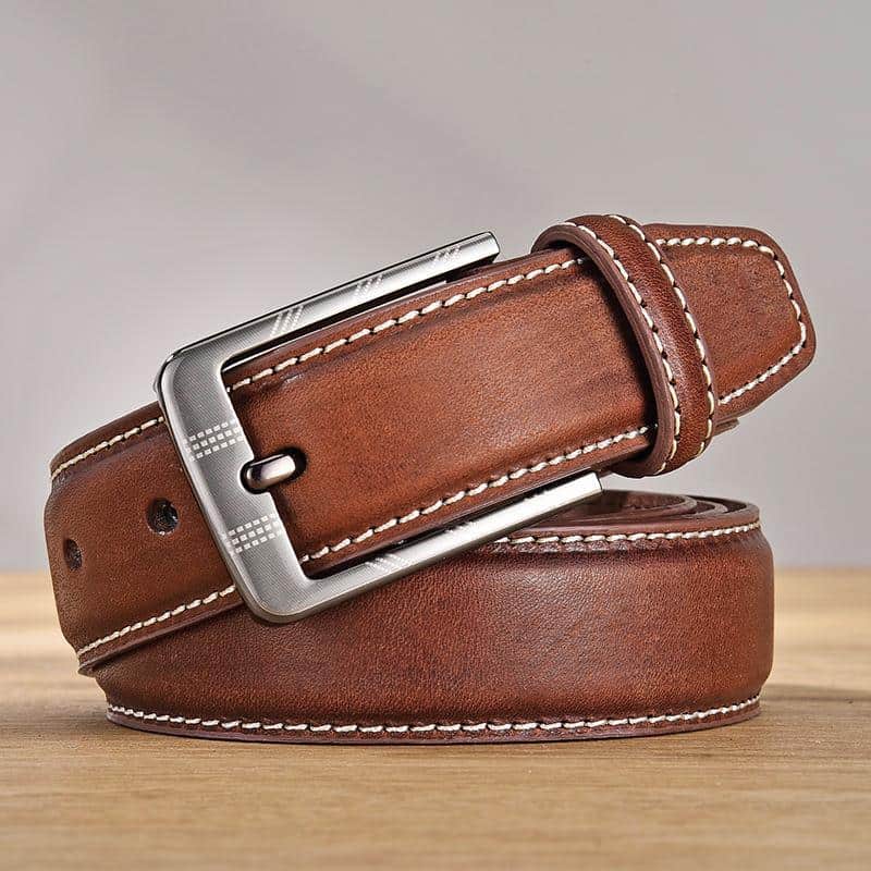 Luxurious brown leather men’s belt with silver buckle, stylish accessory for formal and casual wear. Durable genuine leather and classic design for versatile fashion.