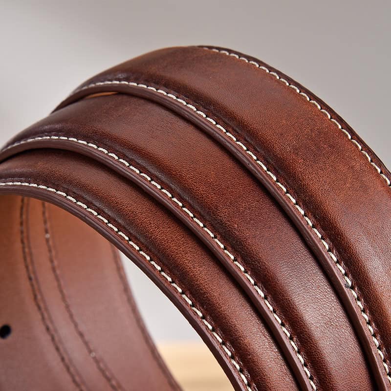 Luxurious brown leather belt with white stitching, stylish and durable accessory for formal or casual outfits. Perfect for fashion-conscious individuals seeking quality belts.