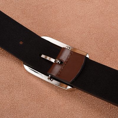 Black leather belt with brown leather loop for men and women, stylish accessory for fashion and formal outfits.