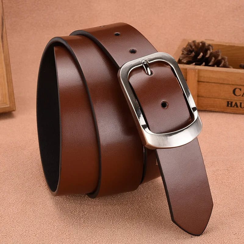 Leather men's belt with a silver buckle, stylish and adjustable accessory for formal and casual wear. High-quality genuine leather belt perfect for fashion and functionality.