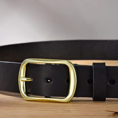 Black leather belt with gold buckle for fashion accessories.