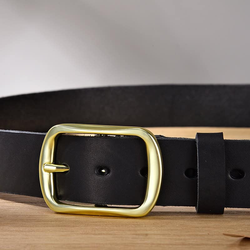 Black leather belt with gold buckle for fashion accessories.