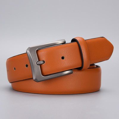 High-quality orange leather belt with matte silver buckle, perfect for stylish men's or women's accessories and fashion statements.