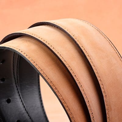 Brown leather belts with black edges for men and women, stylish accessory for casual and formal outfits. Perfect for dressing up or down, showcasing craftsmanship and durability.