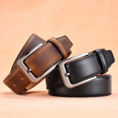 Leather belts with metal buckle display at Monalisa Medical store, emphasizing quality accessories for fashion and functional use.