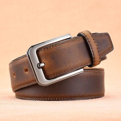 Brown leather men's belt with silver buckle, stylish and durable accessory for formal or casual wear. Perfect for complete your fashion look.