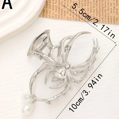 Elegant silver crab-shaped brooch with clear gemstones, perfect for jewelry collection or gifting, featuring detailed claws and a dazzling pearl ornament at the tail.