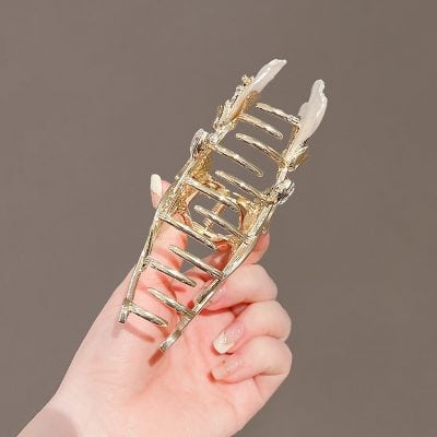 Gold hair clip with intricate baroque design, perfect for adding elegance to your hairstyle at Monalisa Store. Unique hair accessories for stylish women.