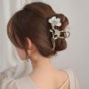 Elegant hair accessory with floral and metallic design, perfect for bridal or formal looks, available at Monalisa Store for stylish hair styling.