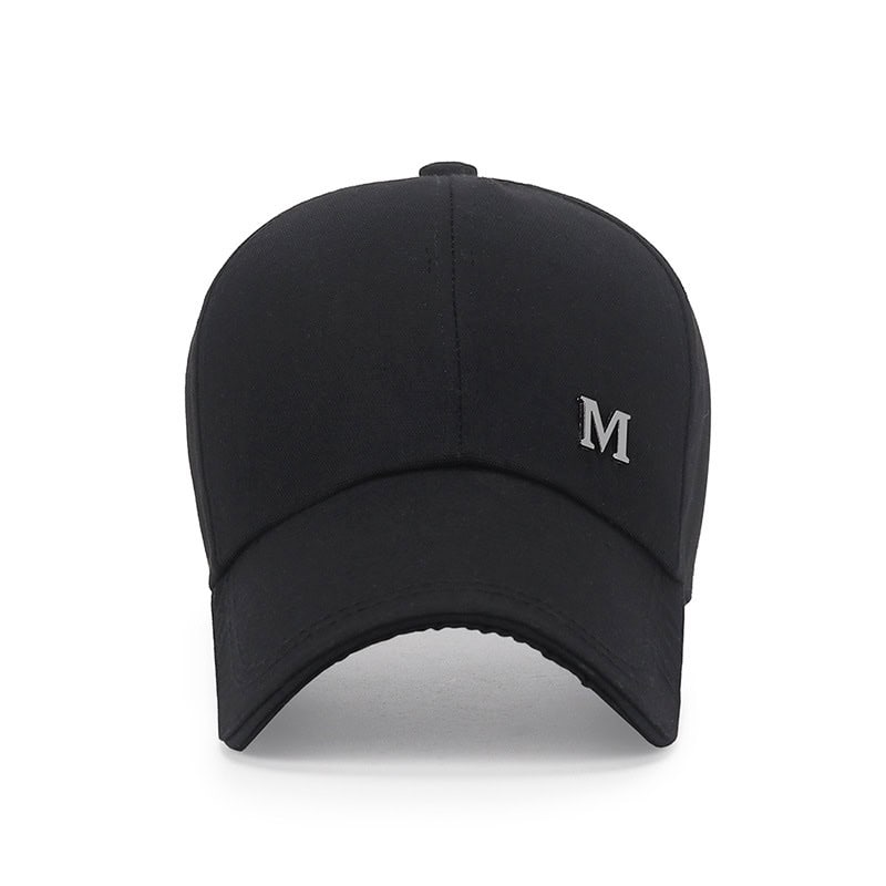 Black baseball cap with embroidered "M" logo, stylish accessory for men and women, perfect for casual wear or sports.
