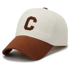 Cleveland Indians baseball cap with adjustable strap, white and brown color, embroidered letter "C" on front, sporty accessory for casual outfits.