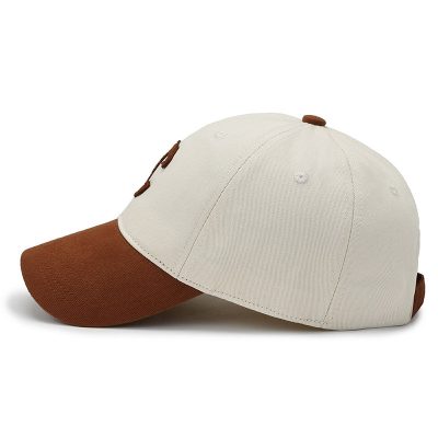 Baseball cap with white crown and brown brim, adjustable strap, stylish sportswear accessory, perfect for outdoor activities, casual wear, and sun protection. Unisex design for all ages.