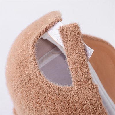 Soft beige suede slip-on shoe with elastic side panels for easy wear, ideal for comfortable casual footwear.