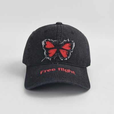 Free flight embroidered butterfly cap, trendy black baseball hat with distressed detail, stylish accessory for casual wear, ideal for outdoor activities, perfect for fashion-forward individuals.