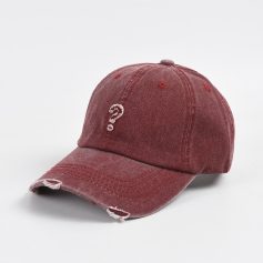 Question mark distressed baseball cap, red worn-out hat with torn edges, casual accessory for streetwear, unique design for fashion-forward individuals, perfect for everyday style and outdoor activities.