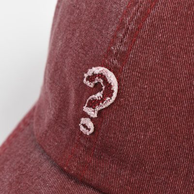Question mark embroidered on red fabric, casual fashion accessory, stylish detail, detail shot of embroidered question mark on red garment at Monalisa Store.