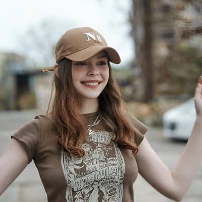 Stylish young woman wearing sunglasses and casual clothing outdoors, showcasing modern eye care accessories at Monalisa Medical Store.
