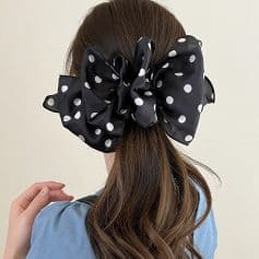 Large black and white polka dot hair scrunchie on brunette hair, stylish hair accessory, Monalisa Store.