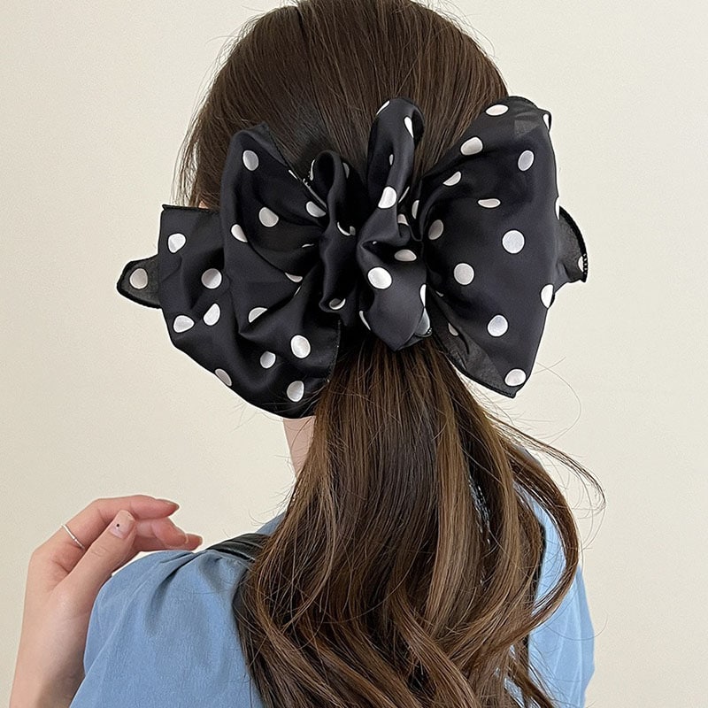 Large black and white polka dot hair scrunchie on brunette hair, stylish hair accessory, Monalisa Store.