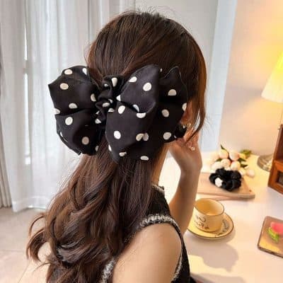 Black polka dot hair bow accessory, stylish clip for women and girls at Monalisa Store, perfect for fashion and hair styling.