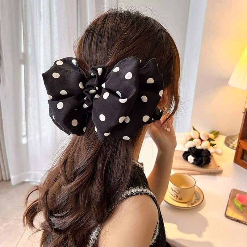 Black polka dot hair bow accessory, stylish clip for women and girls at Monalisa Store, perfect for fashion and hair styling.