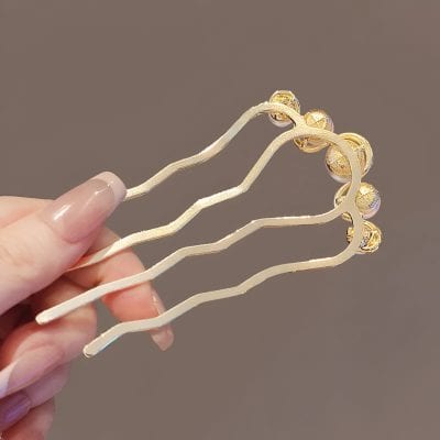 Shiny gold hairpins with decorative pearls and embellishments, perfect for stylish hair accessories or hair styling at Monalisa Store.
