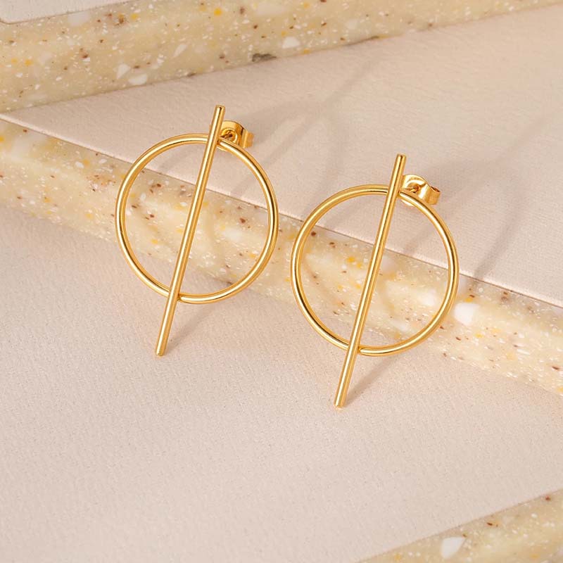 Gold hoop earrings with a modern minimalist bar design, perfect for fashionable accessories and optical style. Elegant jewelry suitable for everyday wear or special occasions.