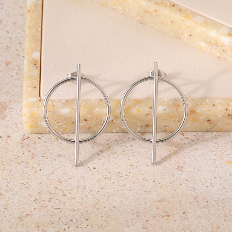 Minimalist silver hoop earrings with vertical bar detail for modern women's jewelry.
