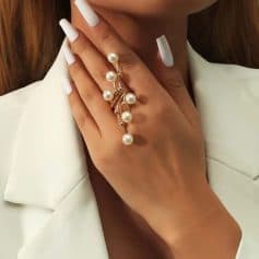 Elegant pearl and gold ring with multiple pearl accents, perfect for sophisticated jewelry collection.