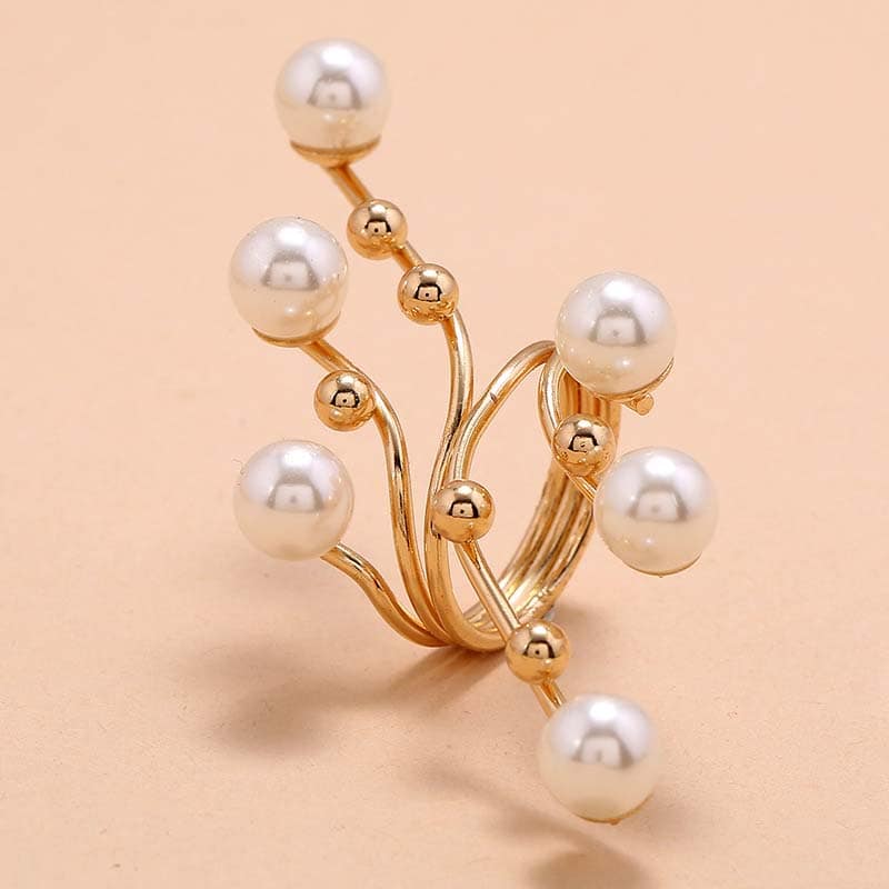 Elegant gold ring with white pearls, perfect for stylish accessories and sophisticated looks. Ideal for women seeking unique jewelry pieces at Monalisa Store.