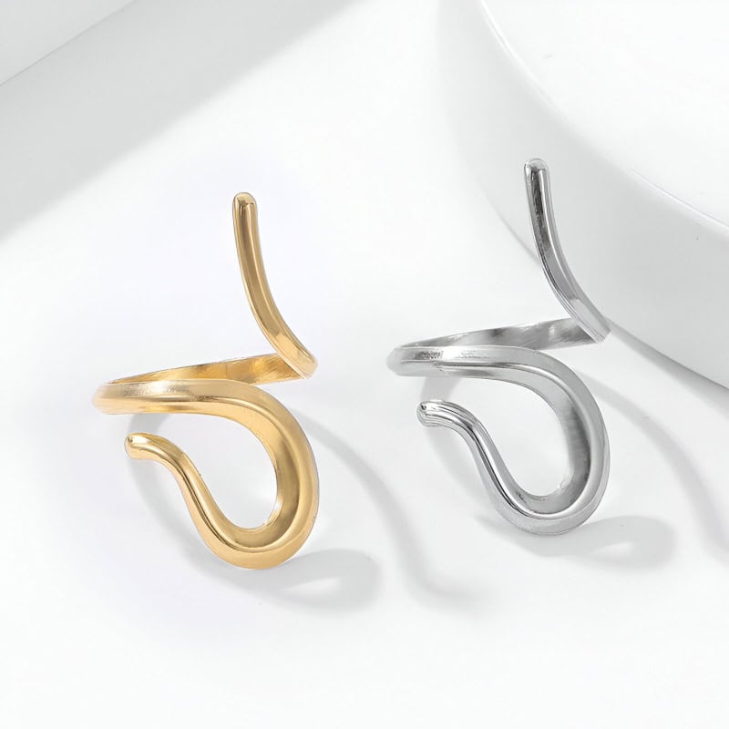 Gold and silver heart-shaped earrings for women in elegant jewelry display.