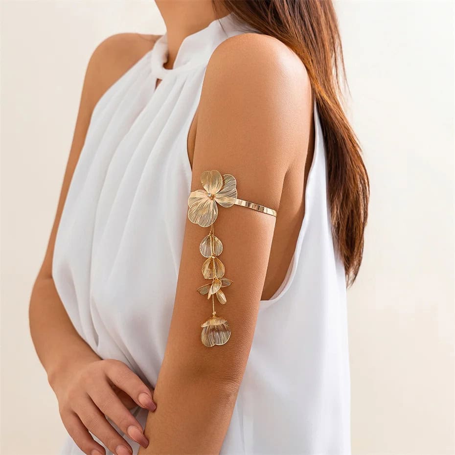 Elegant gold floral arm cuff jewelry with dangling leaves, perfect for enhancing your fashion statement and accessorizing special occasions.