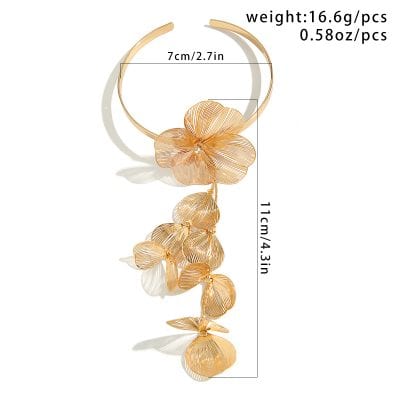 Gold floral statement necklace with petal design and dangling leaf accents, elegant jewelry for women.
