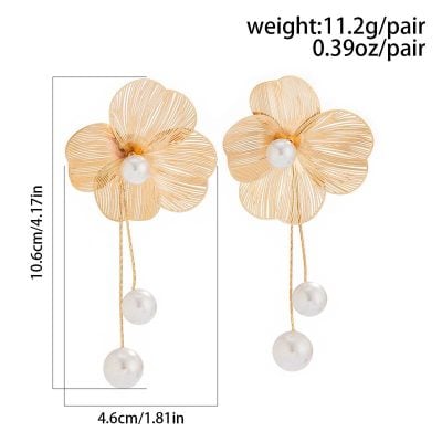 Elegant flower-shaped pearl earrings with gold-tone petals and dangling pearls, ideal for luxury jewelry and special occasions.
