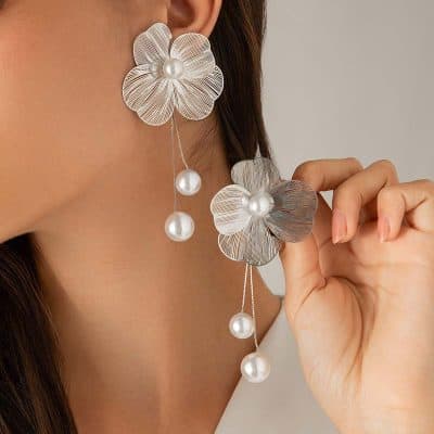 Elegant silver flower pearl earrings for women, featuring intricate petal design with dangling pearl accents, perfect for stylish jewelry collections.