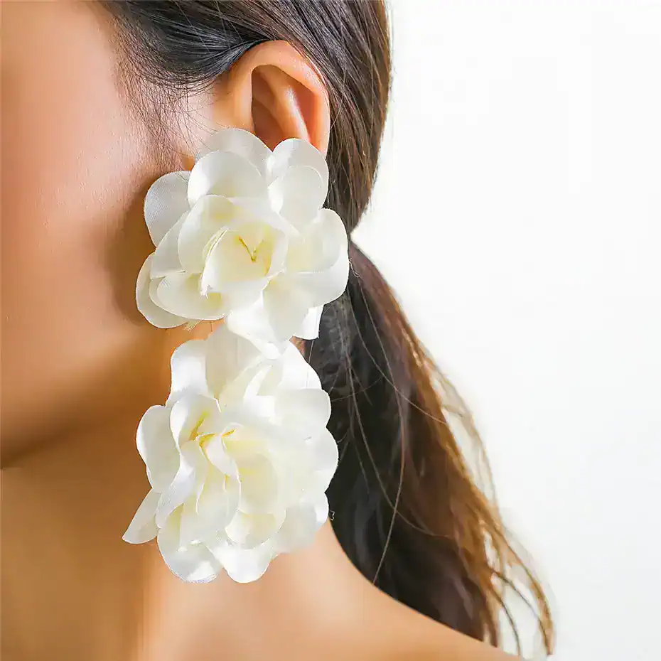 White flower earrings close-up, stylish floral statement jewelry for women, elegant accessories for special occasions, Monalisa Medical store.