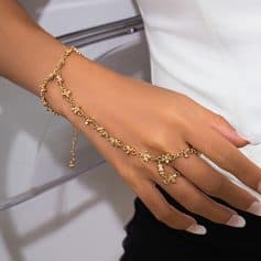 Gold jewelry bracelet and ring on elegant female hand - Monalisa Store, premium jewelry collection for vital style accents and special occasions.