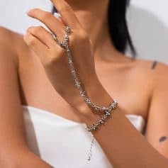 Shiny silver jewelry bracelet and ring set on woman's hand showcasing luxury jewelry for women.