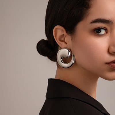 Luxury silver jewelry earring featuring contemporary abstract design, perfect for stylish accessories.