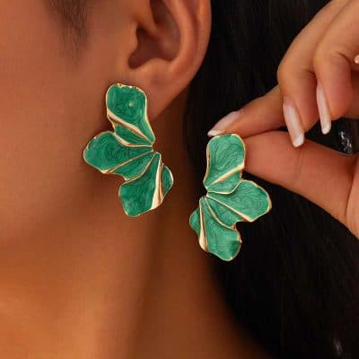 Bold green butterfly-shaped earrings with gold accents, perfect for enhancing your jewelry collection. Quality craftsmanship and stylish design make these earrings ideal for any occasion.