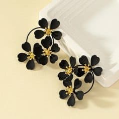 Elegant black floral earrings with gold accents, perfect for enhancing your opt style, suitable for special occasions or everyday wear. Monalisa Store offers fashionable eyewear accessories.